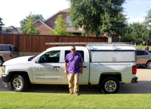 Tactical Owner standing in front of vehicle  