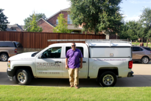 Josh from Tactical Pest Services in front of Pest Vehicle